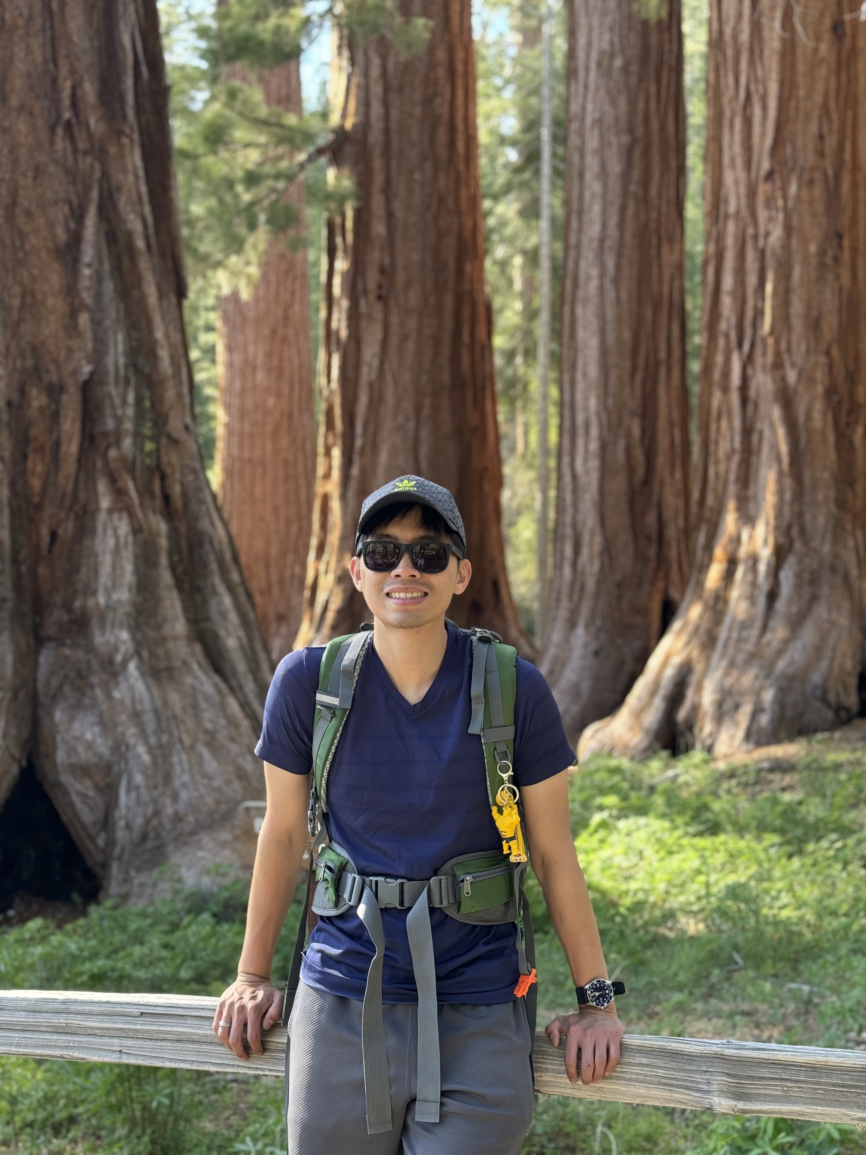 Johnny Koo standing among redwood trees